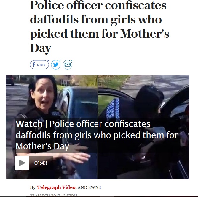 娘たちが摘んだ花、警察官に没収される（出典：http://www.telegraph.co.uk）