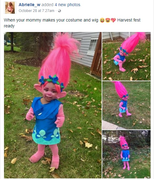 『トロールズ』の妖精“ポピー”に扮した1歳女の子（画像は『Abrielle_w　2017年10月28日付Facebook「When your mommy makes your costume and wig Harvest fest ready」』のスクリーンショット）