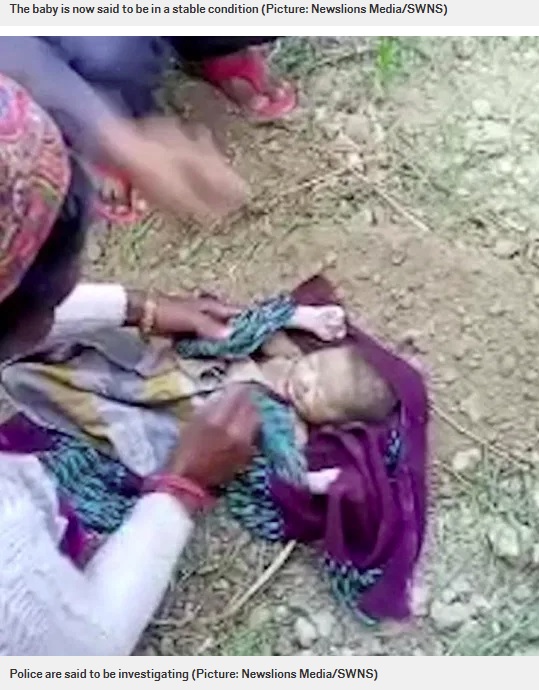 赤ちゃんの顔を拭く女性（画像は『Metro　2020年11月12日付「Newborn baby miraculously saved after being buried alive on farm」（Picture: Newslions Media/SWN））』のスクリーンショット）