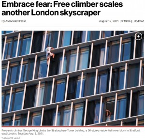 ビルの住人も命綱無しで登る男性に仰天（画像は『New York Post　2021年8月12日付「Embrace fear: Free climber scales another London skyscraper」（Yui Mok/PA via AP）』のスクリーンショット）